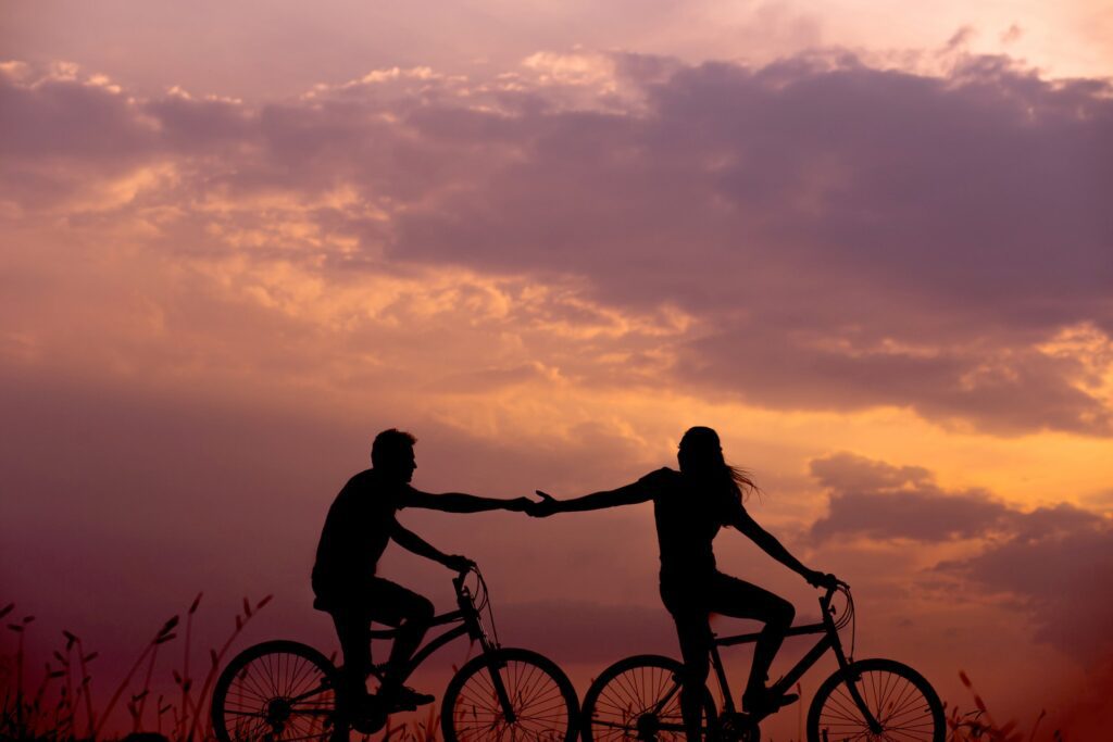 couples riding on sunset