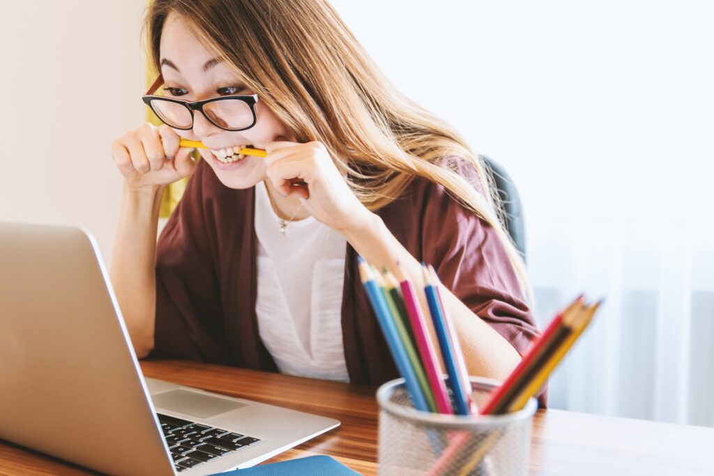 A lady facing a computer