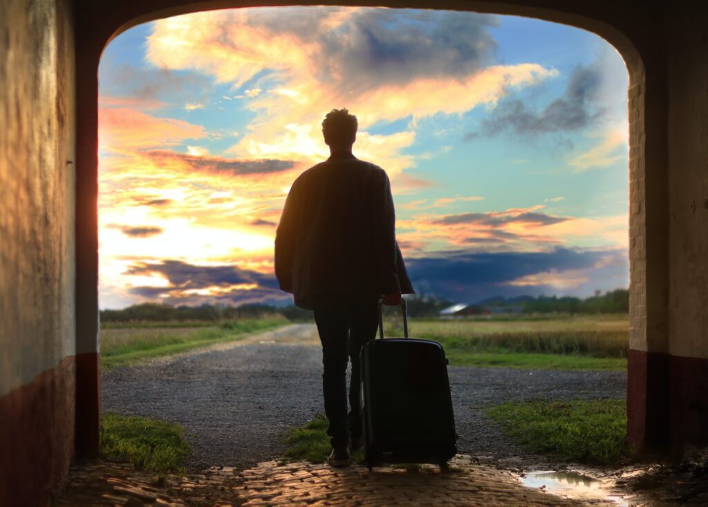 A man carrying a travel bag