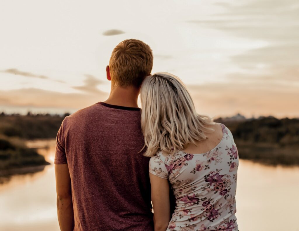 A couple looking over a lake